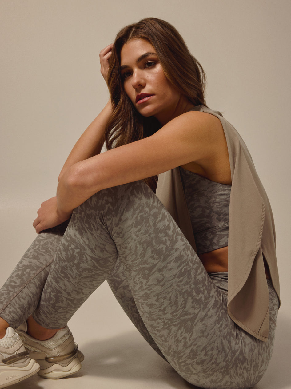 Women's Spring '26 Look 3 - Sage Camo Leggings & Sports Bra with Taupe Vest, Side Seated View | Greyson Clothiers